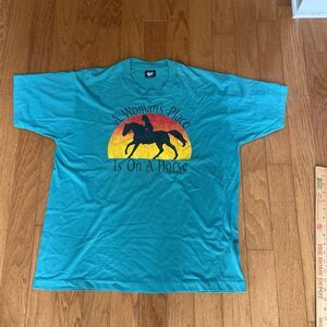 A women’s place is on a horse T-shirt from 1991 Size XL